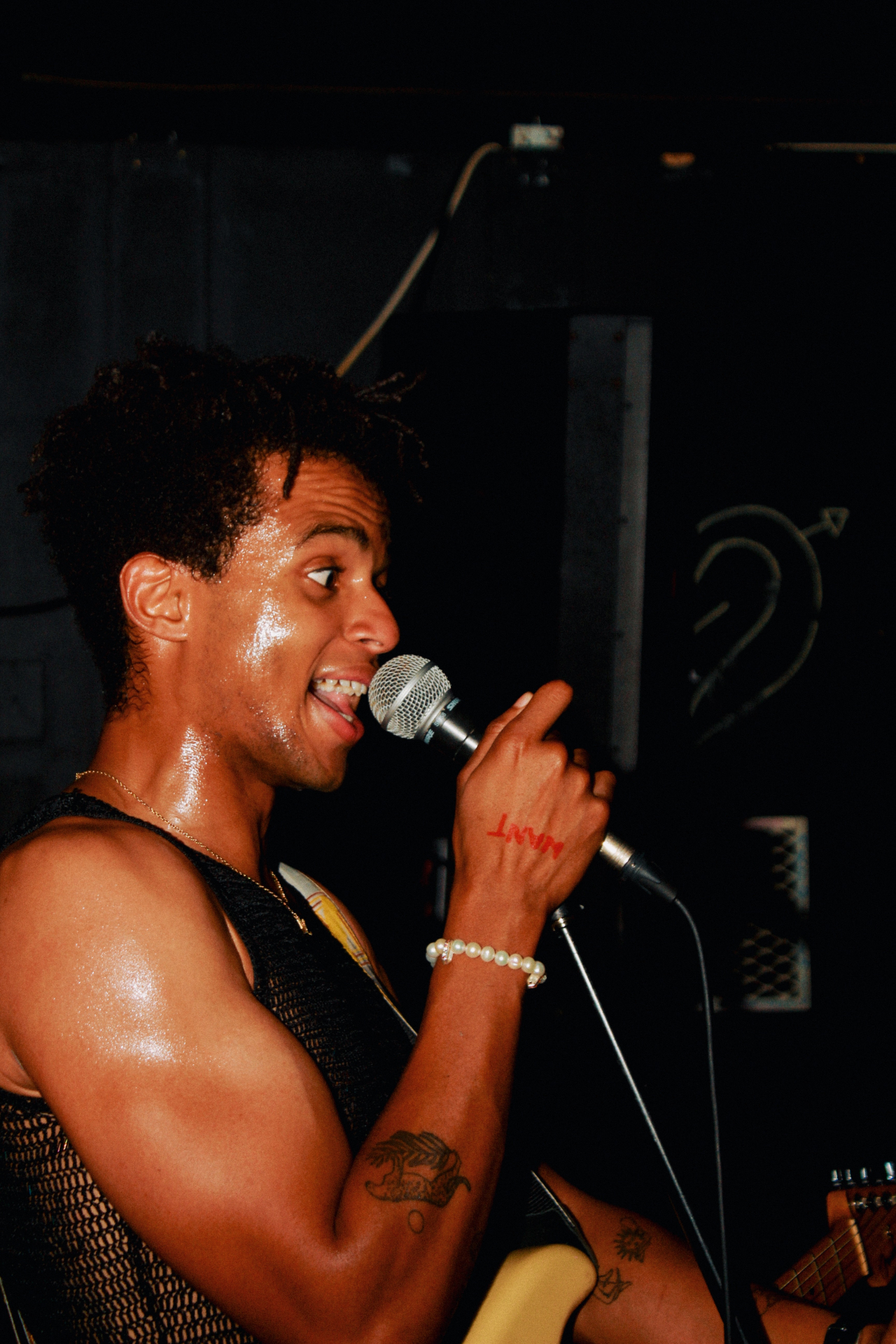 Rudy on the mic in profile